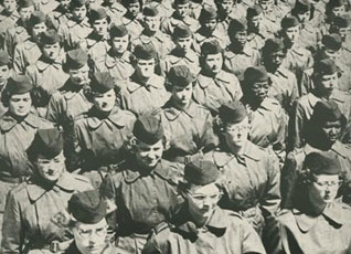 Women stand in formation after being issued First Army green uniform