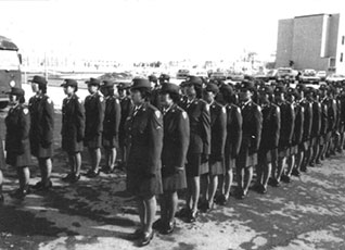 Female military Soldiers standing in formation.