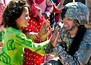 An Army female Soldier in combat gear