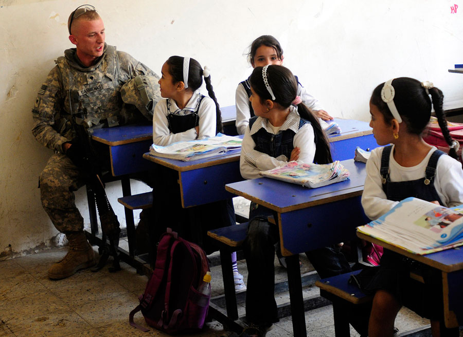 School girls help Soldier with his vocabulary