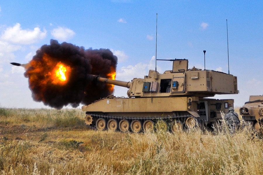 M109A6 Paladin fires 155mm round through cannon