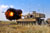 M109A6 Paladin fires 155mm round through cannon