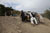 Soldiers help push an Afghan vehicle up hill
