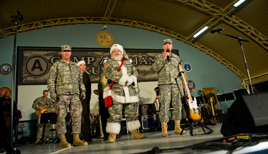 Army Santa Claus in camouflage with Lieutenant General Webster and Sergeant Major Preston in Kuwait