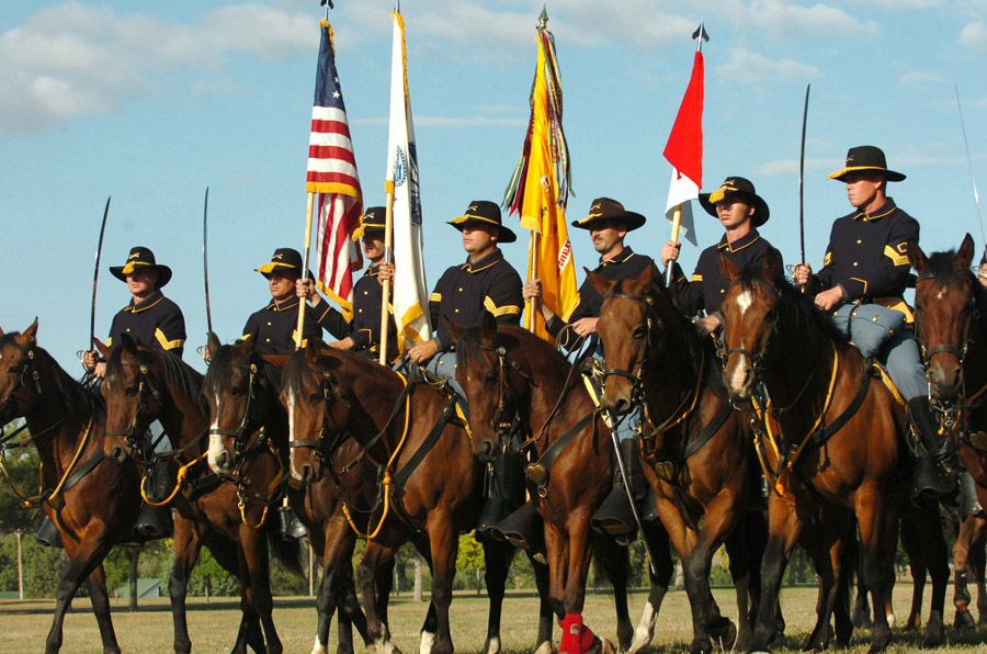 Fort Carson Mounted Color Guard marching in formation