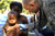 Relief operations Medical officer checks a baby in Port-au-Prince after Haiti earthquake