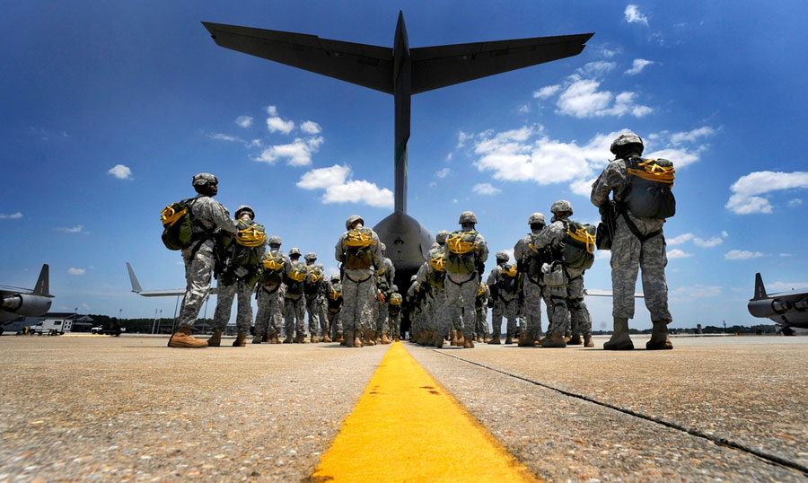Paratroopers wait to board C-17 Globemaster III cargo aircraft