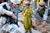 Afghan National Interpreter and Soldier from White Tank talk with Afghan boy during a patrol at a bazaar