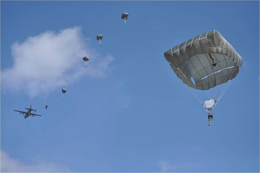 Airborne School students at Fort Benning, Ga., complete jump using Army's new T-11 parachute