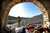 Soldier uses rifle scope to scan hill while providing security outside Afghan police checkpoint