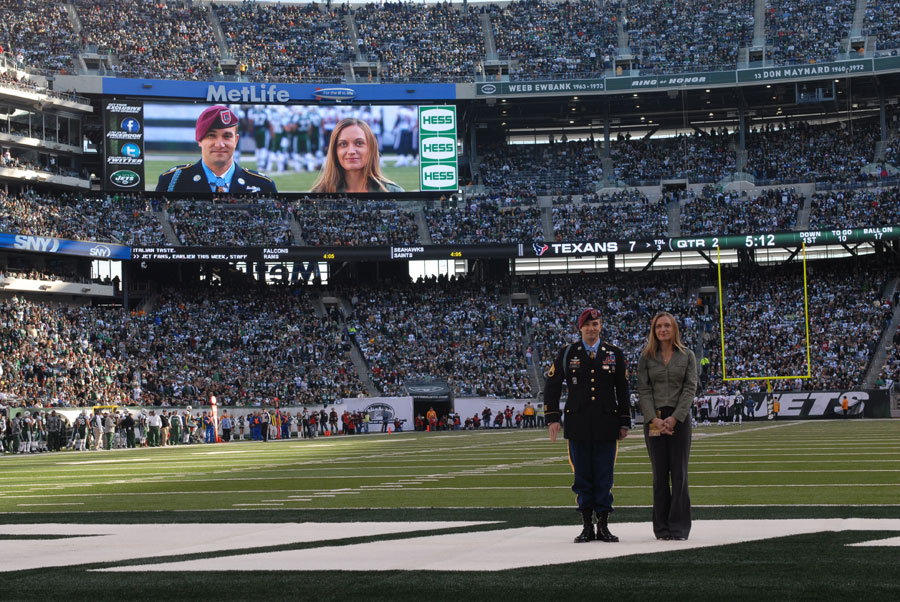 Staff Sergeant Salvatore Giunta at NFL game with his wife Jennifer