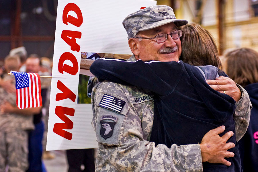 Soldier hugs his daughter returning home from a year-long deployment to Afghanistan