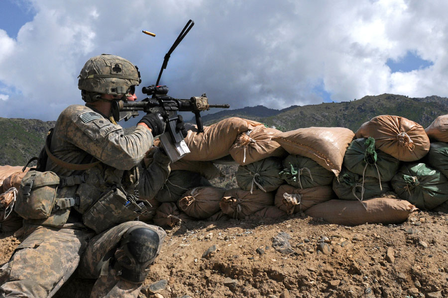 Soldier shooting machine gun duing three hour firefight