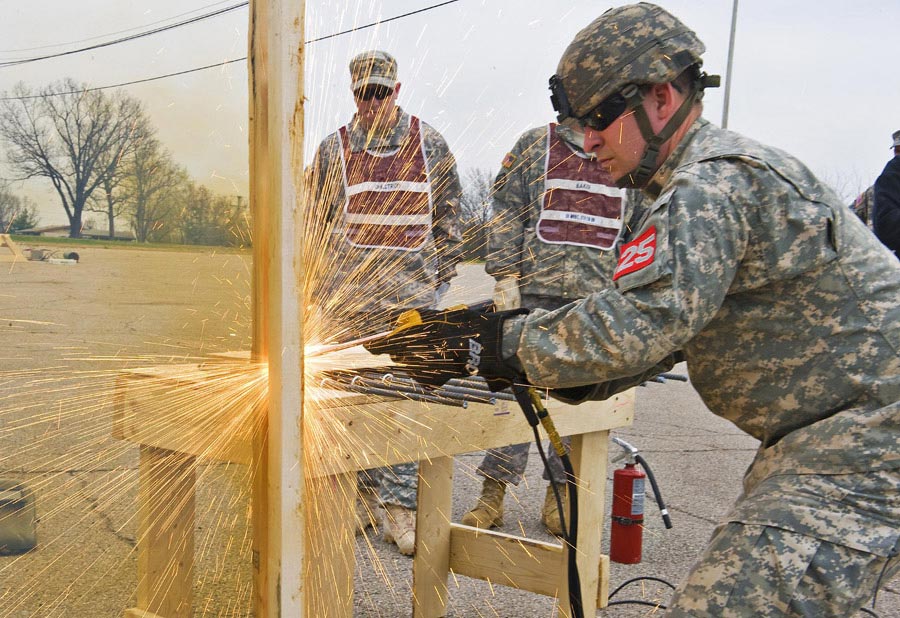 First Lieutenant Presley cuts through door hinges during the thermal breach event of the Best Sapper Competition