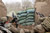 Private First Class Ben Bradley ducks away from small-arms fire, as fellow scout Sergeant Jeff Sheppard, launches grenade at enemy’s position during combat engagement
