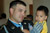 Sergeant First Class Leroy A. Petry, Medal of Honor recipient, 75th Ranger Regiment, poses for a picture with a friend’s child after his welcome home parade in Santa Fe, New Mexico