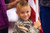 Gunner Butt, son of Sergeant First Class Walter Butt, stands with his family waiting for the return of their deployed Soldier