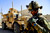 Staff Sergeant David Duhart assesses the security during a mission to a vocational school, Farah City, Farah province, Afghanistan