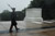 A lone Tomb Guard with the 3rd United States Infantry Regiment (The Old Guard), walks in humble reverence during Hurricane Irene at the Tomb of the Unknown Soldier, Arlington National Cemetery