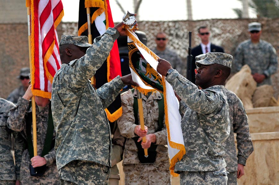 General Lloyd James Austin III and Command Sergeant Major Joseph R. Allen case the USF-I Colors during a ceremony that marked the end of Operation New Dawn