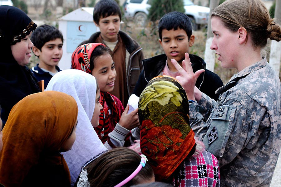 First Lieutenant Rebecca Wagner counts with Afghan children