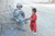 United States Army Soldier saying hello to Afghan child