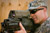 Command Sergeant Major Ronald T. Riling looks through scope of an XM-25 Individual Airburst Weapon System