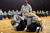 Sergeant First Class Eric Lloyd grades sit-up event of an Army Physical Fitness Test