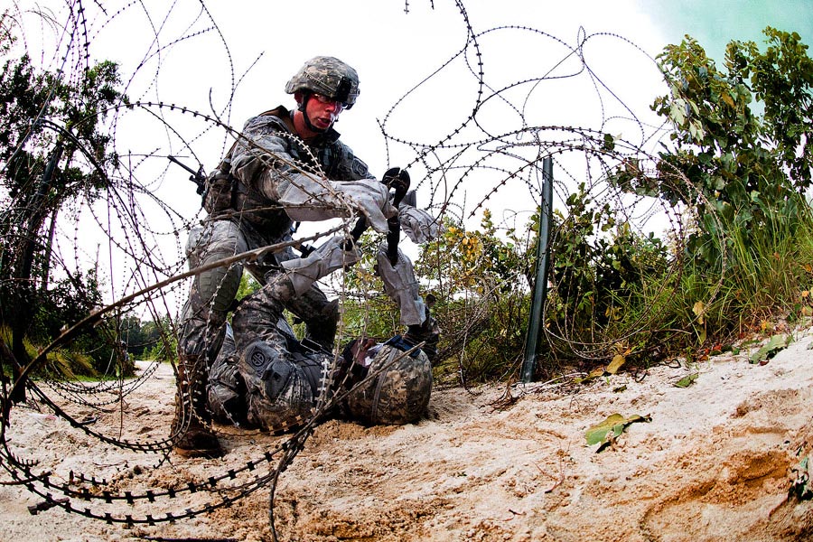 A team of combat engineers with the 82nd Airborne Division’s 1st Brigade Combat Team cuts through a wire obstacle during a training exercise