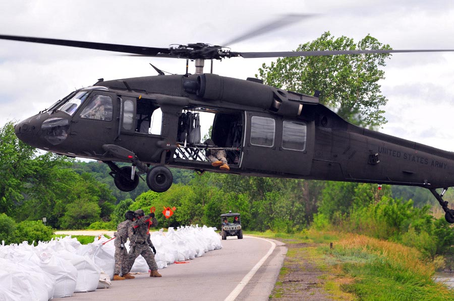 The Missouri National Guard assists Atchison County authorities with personnel and a UH-60 Black Hawk Helicopter to repair levee L550 near Phelps City, Missouri