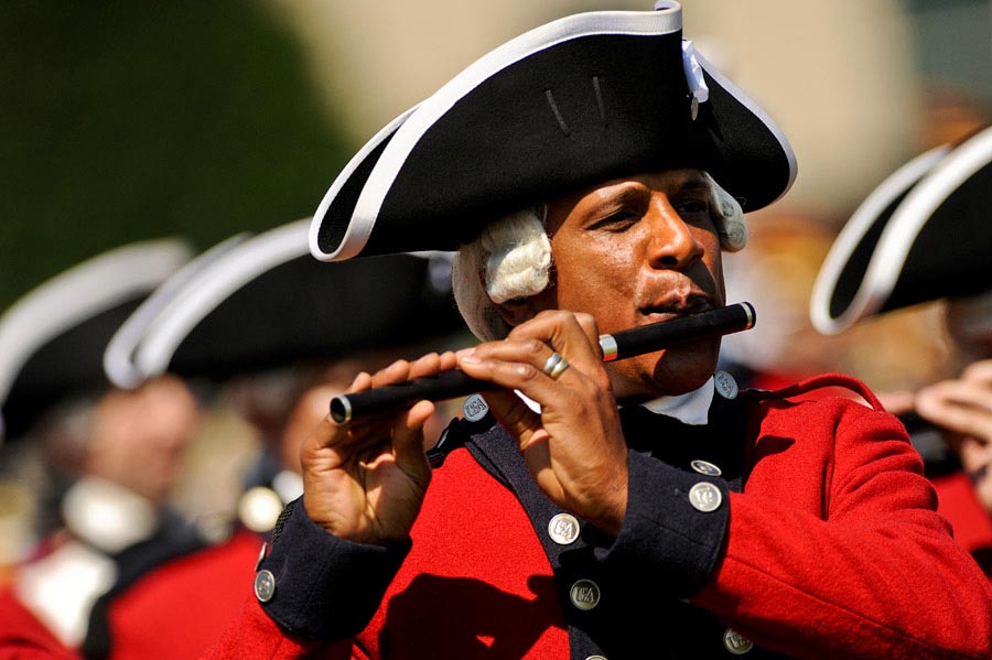 Sergeant First Class Donald P. Francisco, a fifer in the United States Army Old Guard Fife and Drum Corps, marches in parade