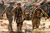 Private First Class Shawn Williams gives the thumbs-up to members of his unit as he is evacuated after being injured by a roadside bomb