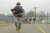 Soldiers prepare to cross the finish line after 12-mile road march during The Old Guard’s Expert Infantryman Badge testing at Fort A.P. Hill, Virginia