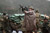 Soldier returns fire with a M249 light machine gun during combat operations in the valley of Barawala Kalet, Kunar province, Afghanistan