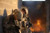 Officers of 1st Stryker Brigade Combat Team, 1st Armored Division, react to an explosion while participating in an urban combat exercise