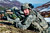 Sergeant First Class Kyle Silvernale yells out commands to his troops during air assault training