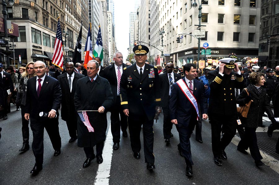 United States Army Chief of Staff General Raymond T. Odierno accompanies Michael Bloomberg, mayor of New York City, and other city officials during the Veterans Day Parade in New York City