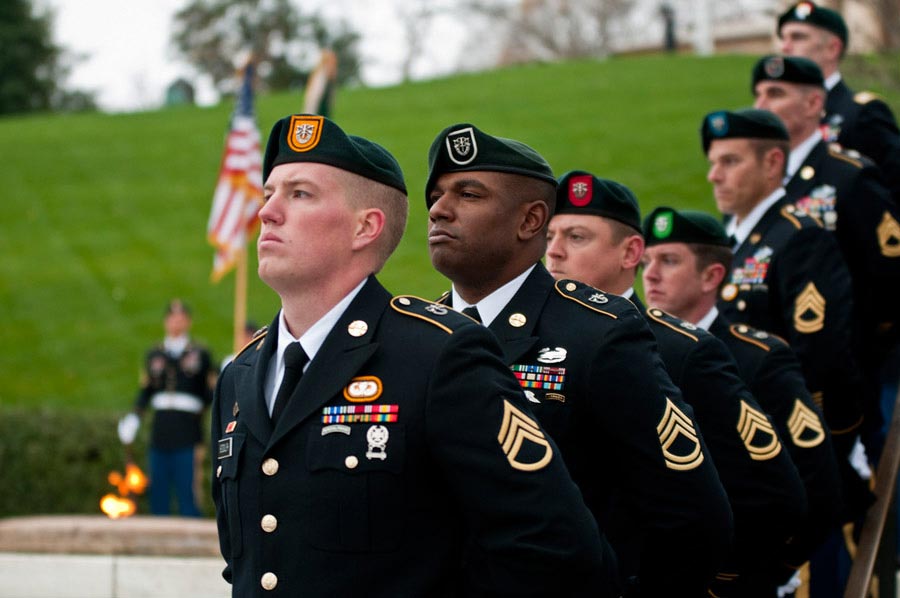 Special Forces Green Beret Soldiers from each of the Army's seven Special Forces Groups stand silent watch during the wreath-laying ceremony at the grave of President John F. Kennedy at Arlington National Cemetery