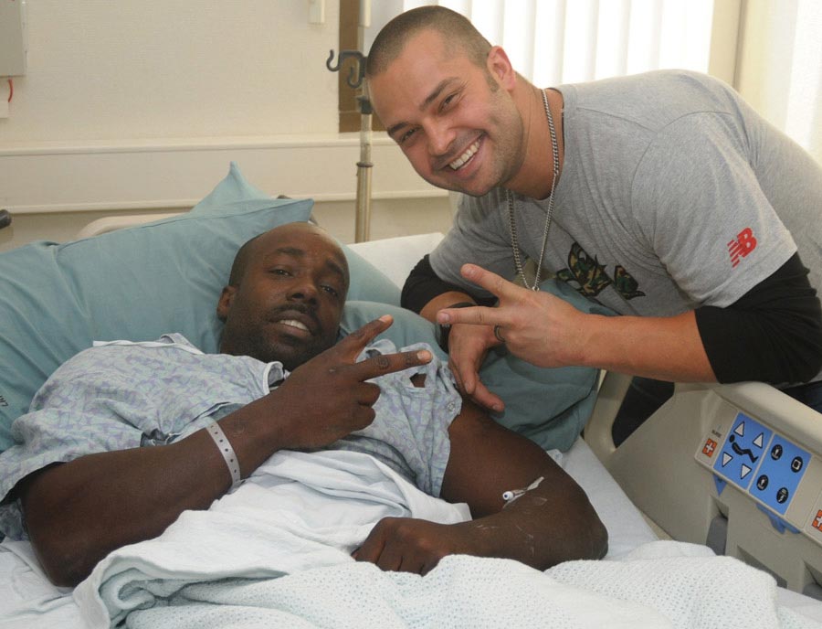 New York Yankees outfielder Nick Swisher meets a Wounded Warrior during his visit with patients and staff at Landstuhl Regional Medical Center