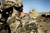 Private First Class Richard Mills secures his eyes and ears as Afghan National Army Soldiers conduct a controlled detonation