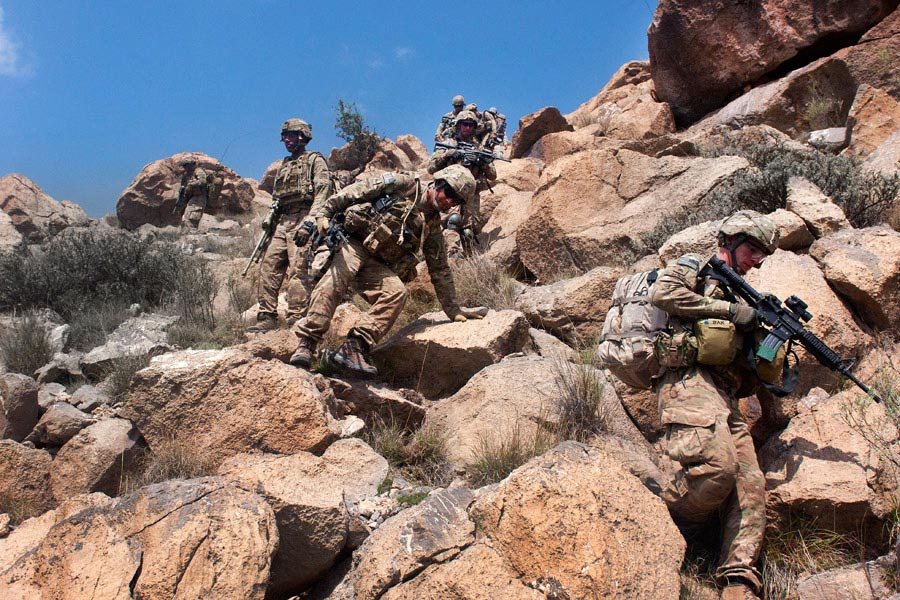 Soldiers begin their descend from the summit of Big Nasty