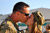 Chief Warrant Officer 2 Bryan Crumpler with the 82nd Combat Aviation Brigade shares a last kiss with his wife