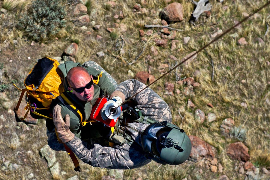 Sergeant Nathan McLaughlin, from Utah Army National Guard, rescues lost hiker, during search and rescue training exercise