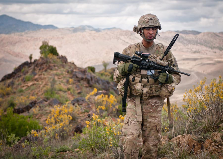 Sergeant First Class Raja Richardson, platoon sergeant with 172nd Infantry Brigade, leads patrol across ridgeline