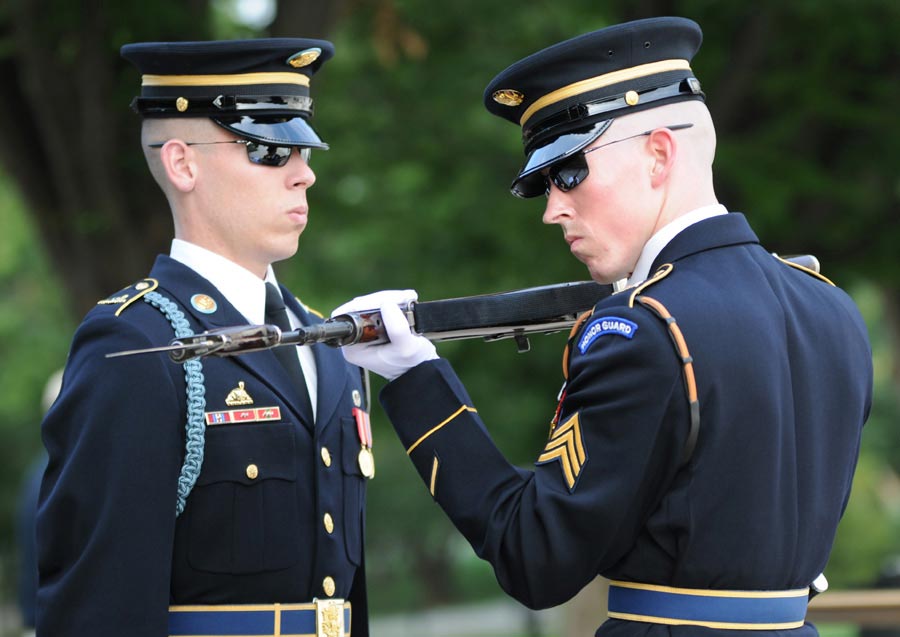 Sergeant Erik McGuire (right), Tomb Sentinel, Tomb of the Unknowns, inspects weapon of Tomb Guard during guard change