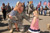 Sergeant First Class Jon Benedict embraces his daughters after landing in Fargo, N.D.