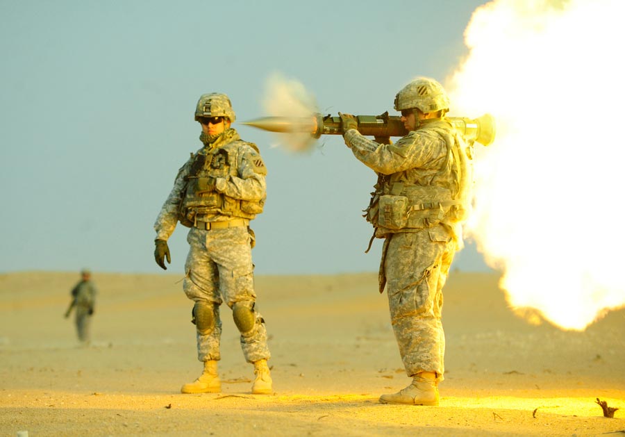 Private First Class Matthew Carpenter, assigned to 3rd Infantry Division, fires an AT-4, an anti-tank weapon, near Camp Buehring, Kuwait