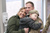 Valerie Kagan and her son Sean, hold tightly to their returning 2nd Infantry Division Soldier, Sergeant First Class Jeremy Kagan, after welcome-home ceremony