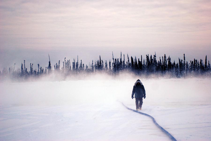 Soldier from 56th Engineer Company walks Tanana River's frozen surface during ice-bridge construction