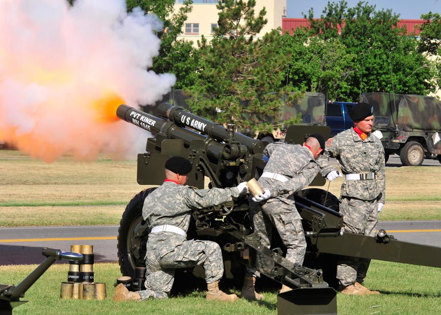 Soldiers from 2nd Field Artillery fire salute to tune of the 1812 Overture during Independence Day Ceremony